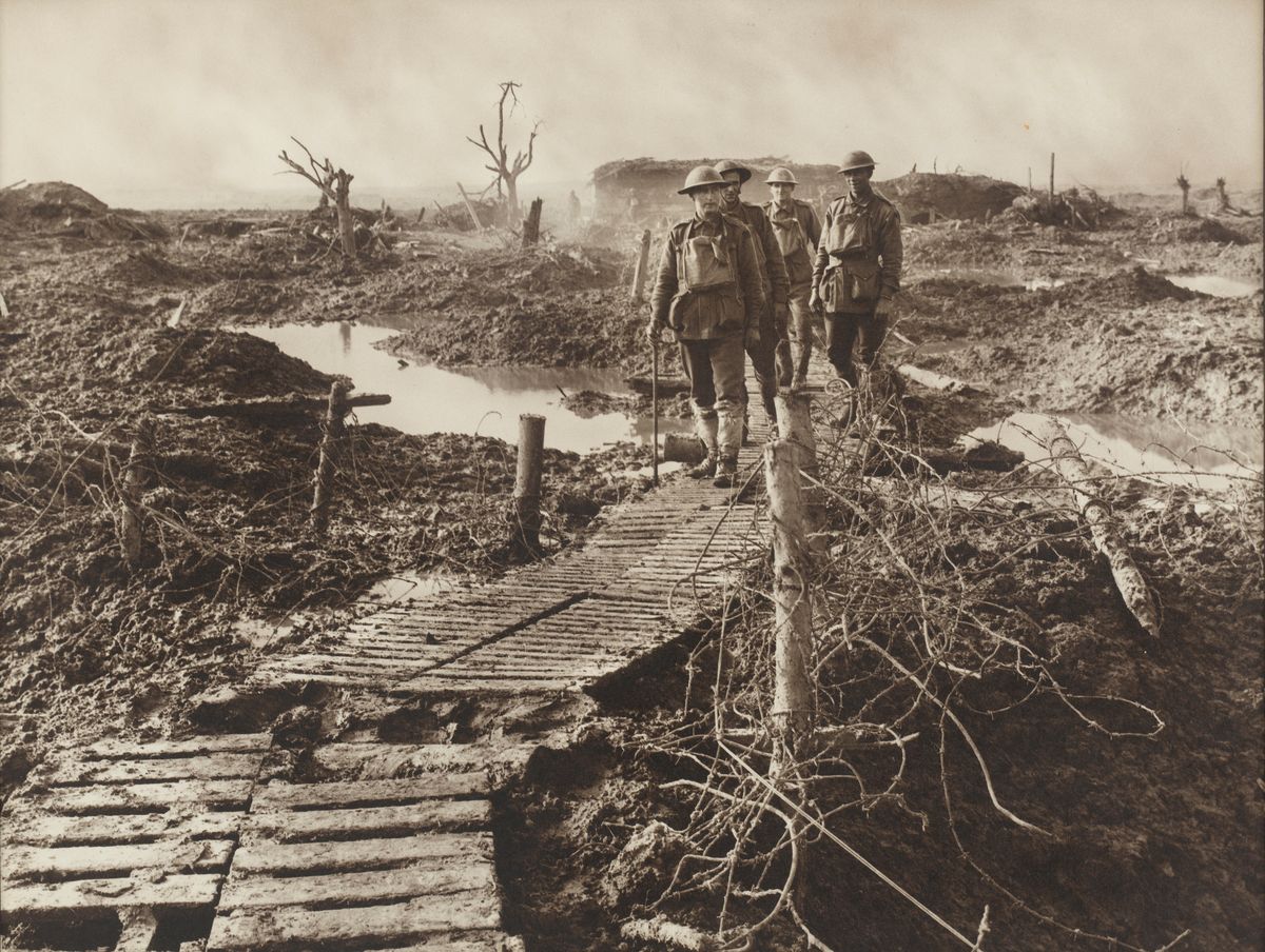 Duckboards offer the only way through the mudbaths of Flanders battlefields (Frank Hurley — State Library of NSW)